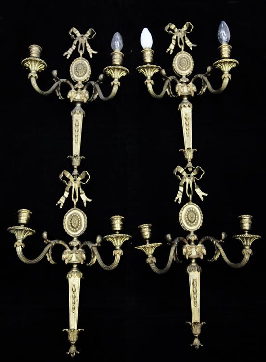 A set of four Adam style ormolu twin branch wall lights, 20in.